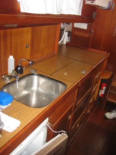 Slide: The Image of Interior of 1974 Hallberg-Rassy Rasmus 35 yacht with wooden kitchen. - 12