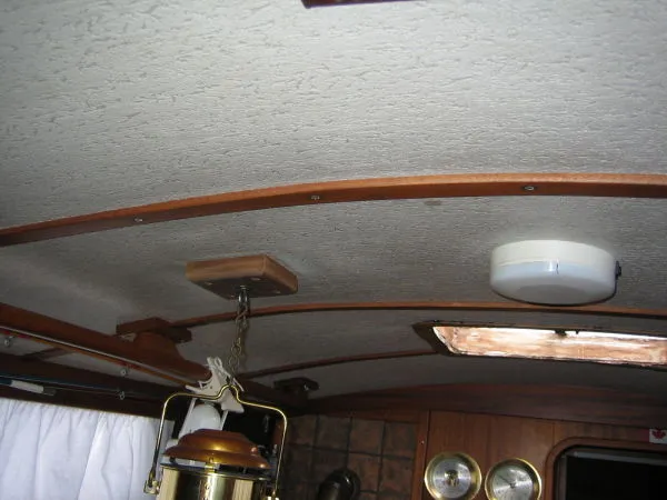Slide: The Image of 1974 Hallberg-Rassy Rasmus 35 yacht interior with wooden accents. - 22