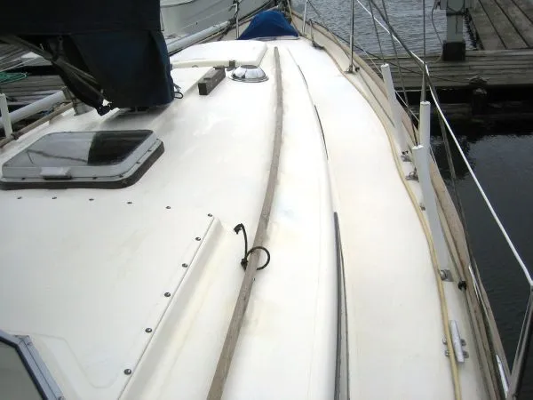 Slide: The Image of Deck of a 1974 Hallberg-Rassy Rasmus 35 sailboat in harbor. - 31