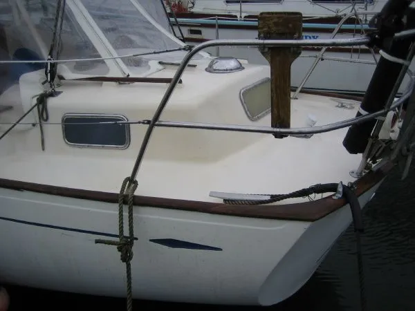 Slide: The Image of 1974 Hallberg-Rassy Rasmus 35 sailboat docked in harbor. - 39