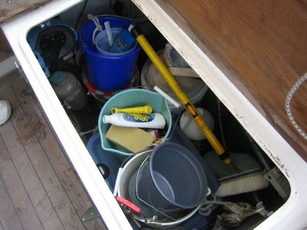 Slide: The Image of Storage compartment on 1974 Hallberg-Rassy Rasmus 35 with cleaning supplies. - 41