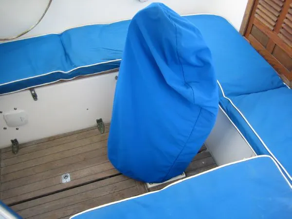 Slide: The Image of Interior of a 1974 Hallberg-Rassy Rasmus 35 yacht with blue cushions. - 45
