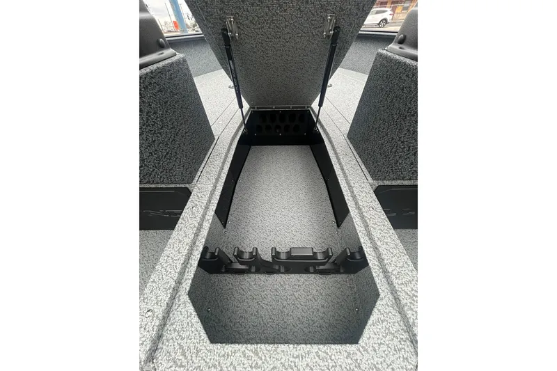 Slide: The Image of 2026 Lund 1700 Explorer Sport boat interior storage compartment open. - 20