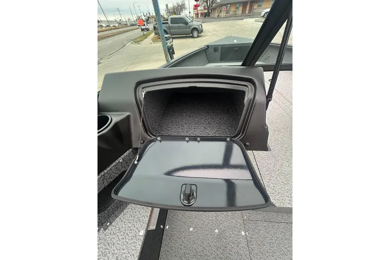Slide: The Image of 2026 Lund 1700 Explorer Sport boat interior storage compartment open. - 22