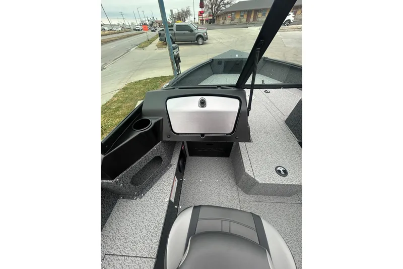 Slide: The Image of 2026 Lund 1700 Explorer Sport boat interior with seating and storage compartments. - 23