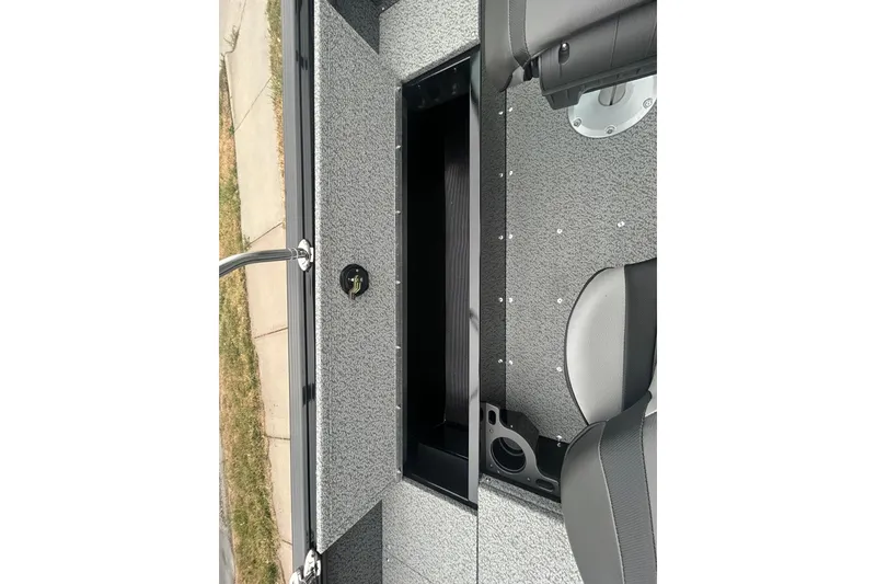 Slide: The Image of 2026 Lund 1700 Explorer Sport interior with storage compartment and seating. - 24