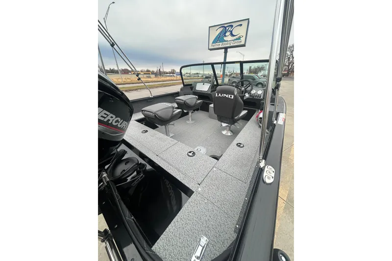 Slide: The Image of 2026 Lund 1700 Explorer Sport boat interior with seating and dashboard, at Premier Boating Center. - 35