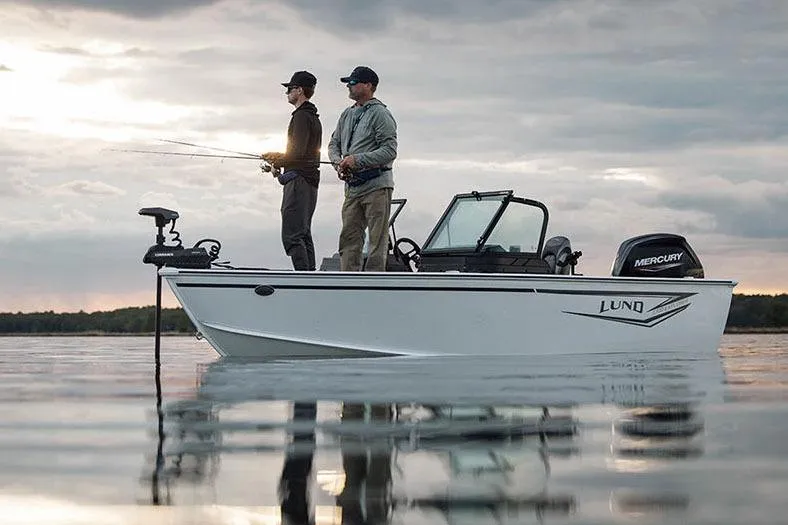 Slide: The Image of Manufacturer Provided Image: Two people fishing on a 2026 Lund 1700 Explorer Sport boat at sunset. - 36