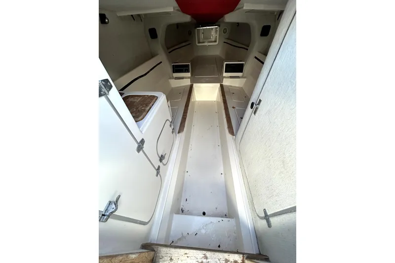 Slide: The Image of Interior of a 1989 Cigarette Cafe Racer 35 boat, featuring a clean, minimalist cabin design. - 10