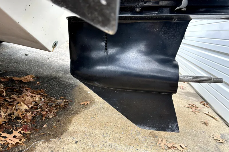 Slide: The Image of 1989 Cigarette Cafe Racer 35 boat part, showing black propeller shaft and surrounding area. - 13