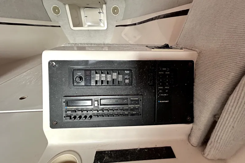 Slide: The Image of 1989 Cigarette Cafe Racer 35 interior audio control panel with vintage Blaupunkt system. - 19