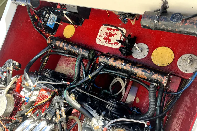 Slide: The Image of Engine compartment of a 1989 Cigarette Cafe Racer 35 boat, showcasing mechanical components. - 27