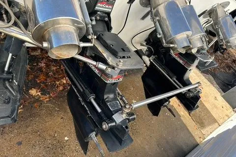 Slide: The Image of 1989 Cigarette Cafe Racer 35 boat engines with stainless steel components and dual outboard motors. - 8