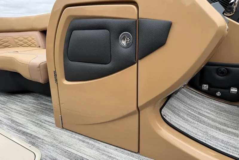 Slide: The Image of 2026 Godfrey Monaco 235 SFLC iMPACT boat interior with tan seating and sleek design. - 12