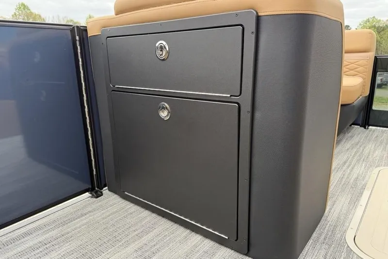 Slide: The Image of Storage compartment on 2026 Godfrey Monaco 235 SFLC iMPACT boat, featuring sleek design and secure locks. - 16