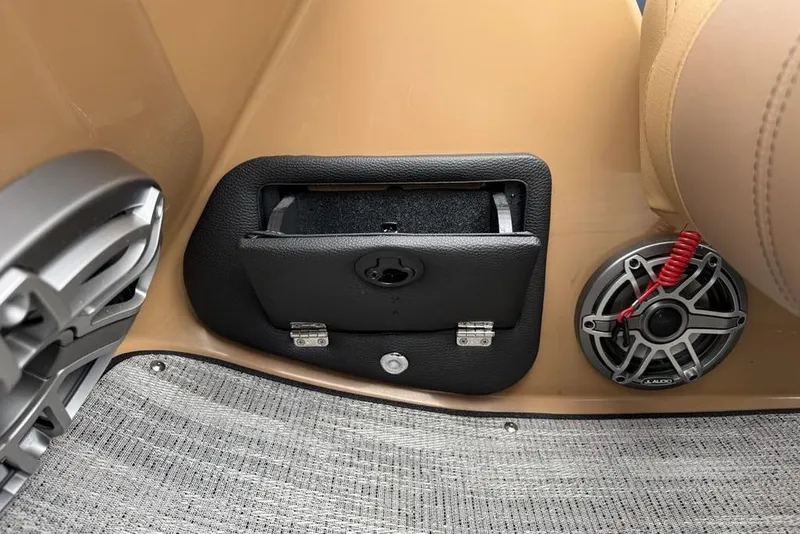 Slide: The Image of Interior of 2026 Godfrey Monaco 235 SFLC iMPACT with speaker and storage compartment. - 23