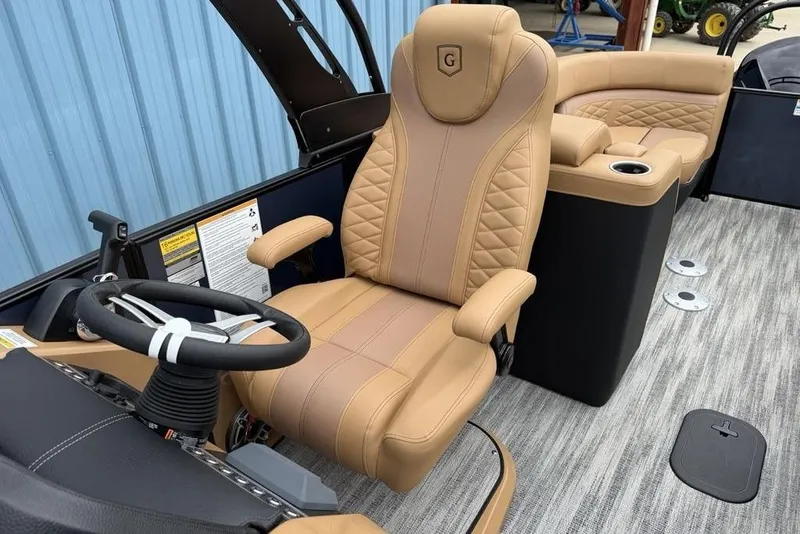 Slide: The Image of Luxurious interior of 2026 Godfrey Monaco 235 SFLC iMPACT pontoon boat with tan seating. - 24