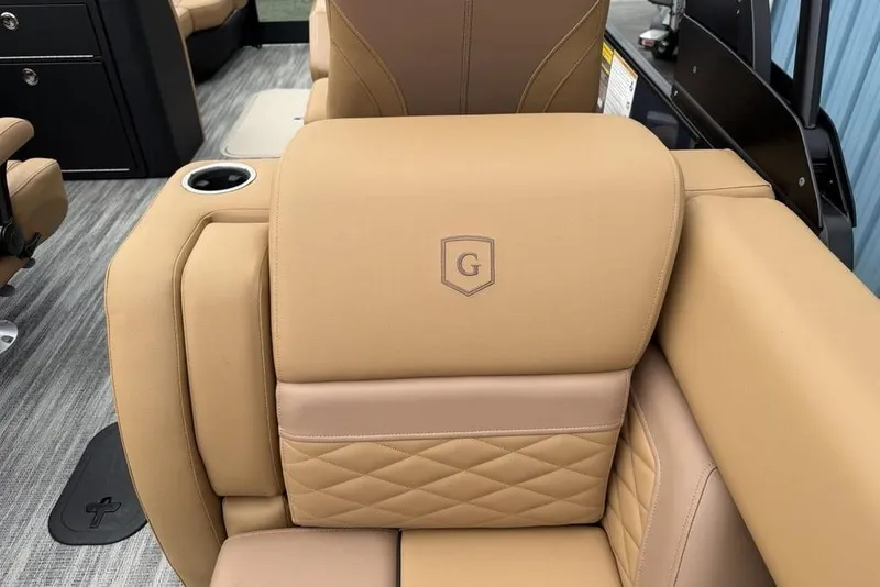 Slide: The Image of Luxurious tan seating on 2026 Godfrey Monaco 235 SFLC iMPACT boat, featuring quilted design and cup holder. - 28