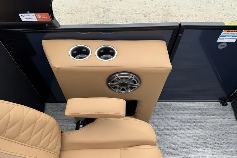 Slide: The Image of 2026 Godfrey Monaco 235 SFLC iMPACT boat interior with beige seating and cup holders. - 29