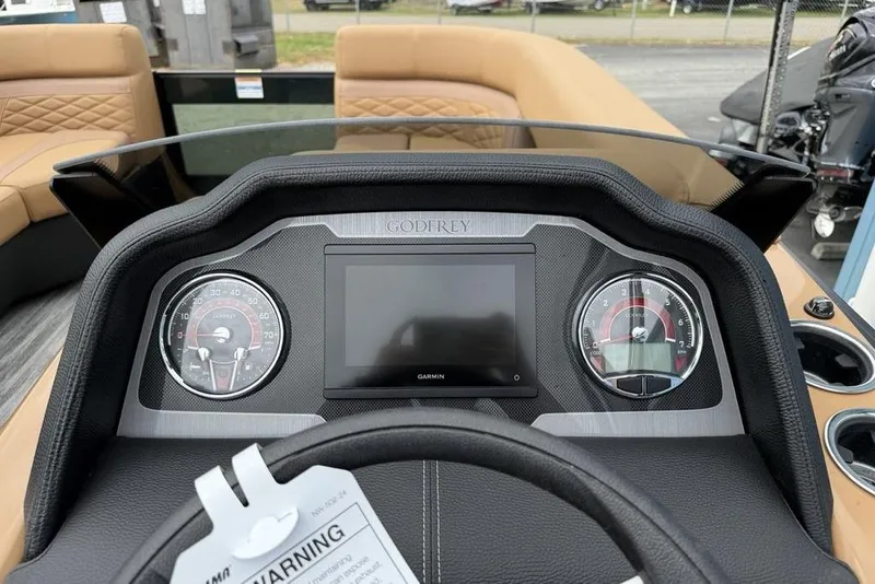 Slide: The Image of Dashboard of 2026 Godfrey Monaco 235 SFLC iMPACT boat with gauges and Garmin display. - 36