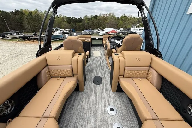 Slide: The Image of Luxurious interior of 2026 Godfrey Monaco 235 SFLC iMPACT pontoon boat with tan seating. - 38