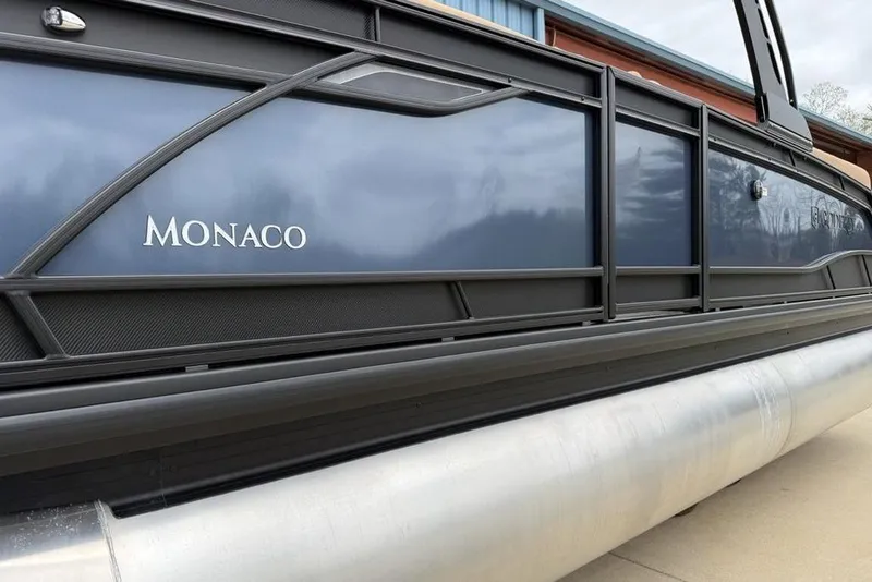 Slide: The Image of 2026 Godfrey Monaco 235 SFLC iMPACT pontoon boat, sleek design, side view. - 4