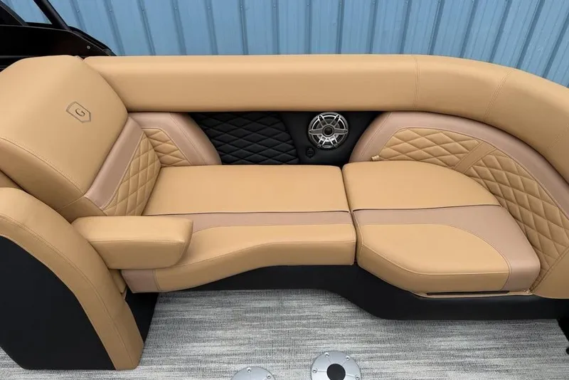 Slide: The Image of Luxurious tan seating on 2026 Godfrey Monaco 235 SFLC iMPACT boat, featuring quilted design and speaker. - 41