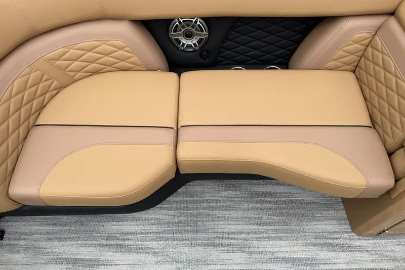 Slide: The Image of Luxurious tan seating on 2026 Godfrey Monaco 235 SFLC iMPACT boat, featuring quilted design and speaker. - 5