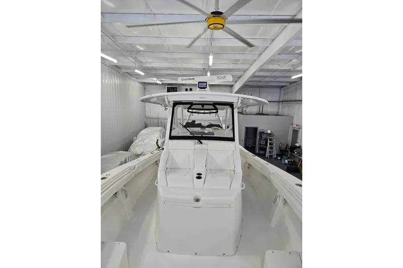 Slide: The Image of 2020 Regulator 41 boat in storage, featuring Garmin electronics and spacious deck. - 47
