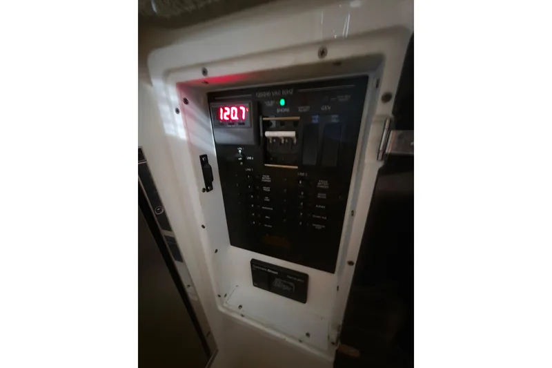 Slide: The Image of Electrical panel of 2020 Regulator 41 boat displaying voltage reading. - 53