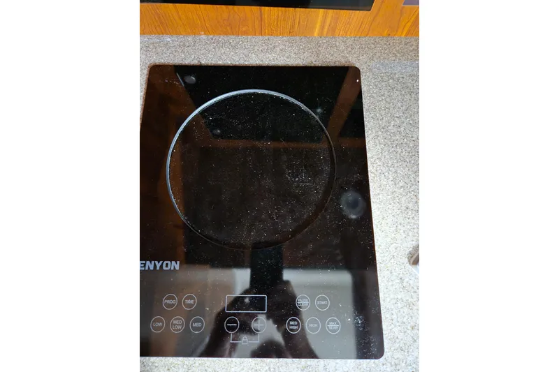 Slide: The Image of Kenyon induction cooktop on Regulator 41 boat, 2020 model, with touch controls. - 55