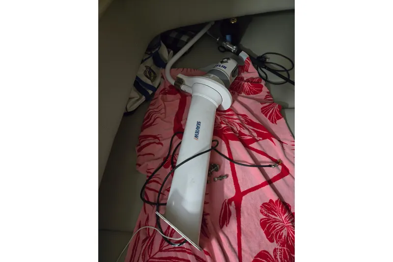 Slide: The Image of 2020 Regulator 41 boat component with cables on a floral-patterned fabric. - 56