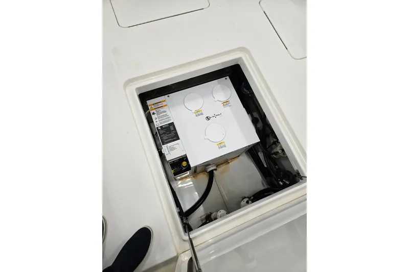Slide: The Image of 2020 Regulator 41 boat compartment with electrical components and wiring. - 60