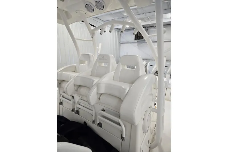 Slide: The Image of Luxurious white seating on a 2020 Regulator 41 boat, showcasing premium craftsmanship. - 65