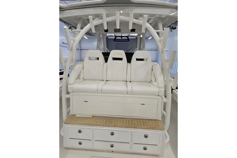 Slide: The Image of 2020 Regulator 41 boat interior with white seating and storage compartments. - 66