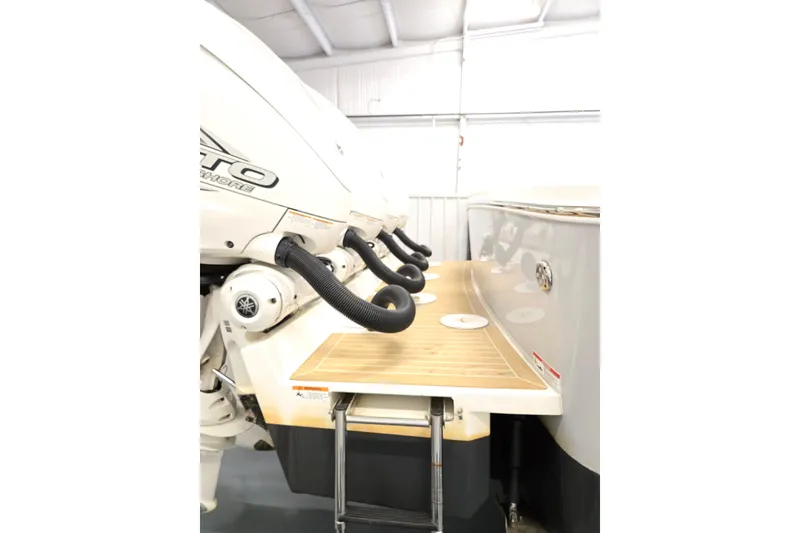 Slide: The Image of 2020 Regulator 41 boat with powerful outboard engines and teak swim platform. - 67