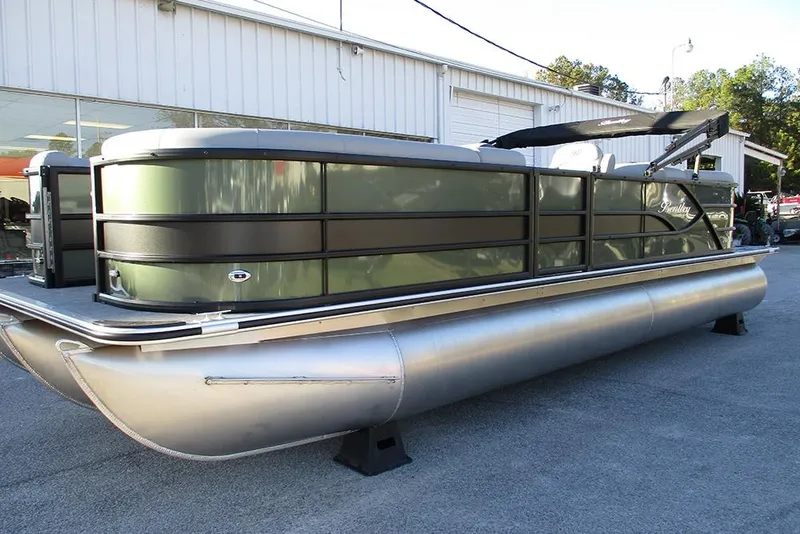 The Image of 2026 Bentley Pontoons Legacy 243 Navigator pontoon boat displayed outdoors. - 0
