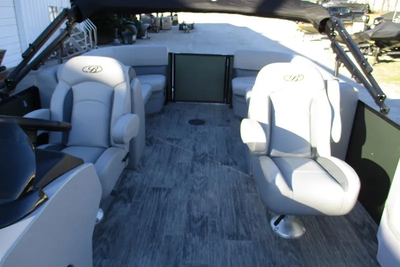 Slide: The Image of 2026 Bentley Pontoons Legacy 243 Navigator interior with plush seating and modern design. - 17