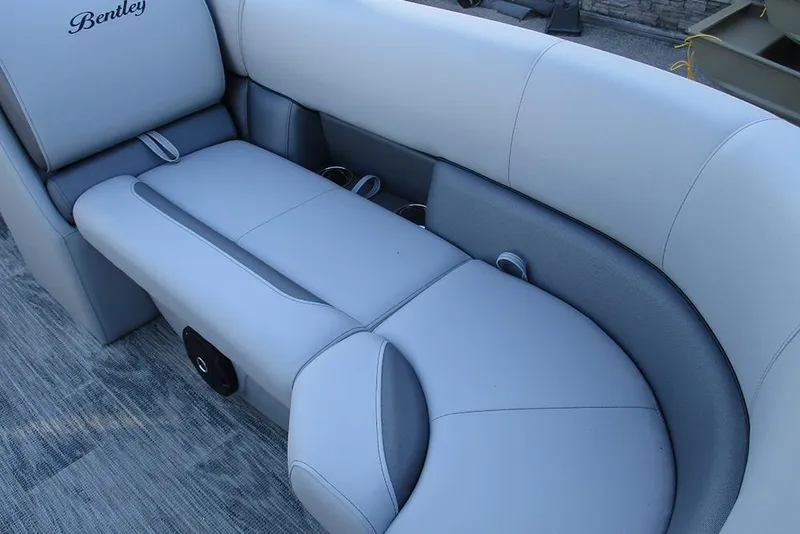 Slide: The Image of Luxurious seating on 2026 Bentley Pontoons Legacy 243 Navigator, featuring elegant gray upholstery. - 19