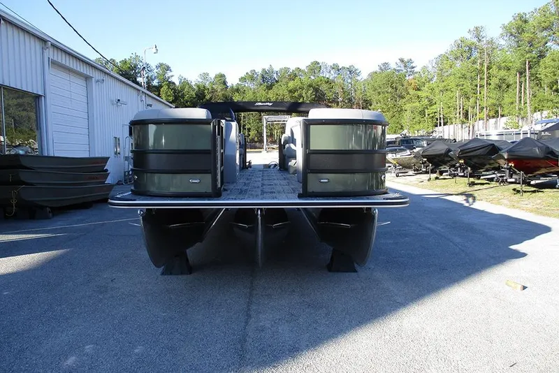Slide: The Image of 2026 Bentley Pontoons Legacy 243 Navigator at a dealership, front view. - 2