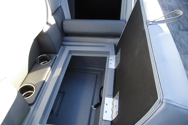 Slide: The Image of 2026 Bentley Pontoons Legacy 243 Navigator storage compartment with cup holders and cushioned seating. - 27