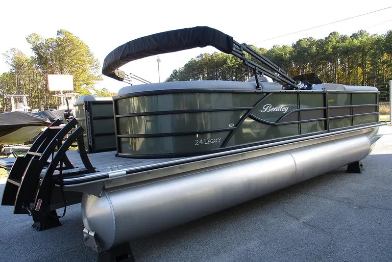 Slide: The Image of 2026 Bentley Pontoons Legacy 243 Navigator pontoon boat on display outdoors. - 4