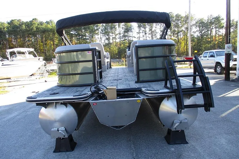 Slide: The Image of 2026 Bentley Pontoons Legacy 243 Navigator, rear view, parked outdoors. - 6