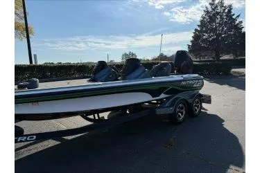 Slide: The Image of 2019 Nitro Z21 boat parked outdoors on a sunny day. - 3