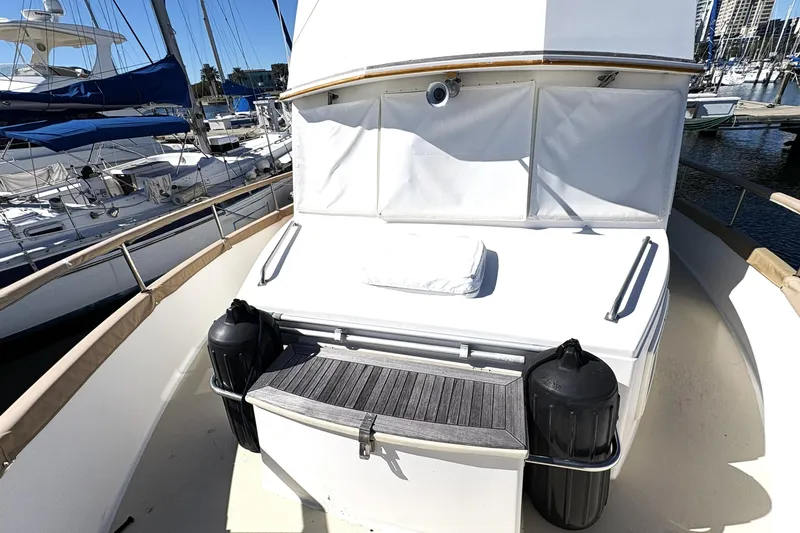 Slide: The Image of 1993 Grand Banks 42 Classic yacht deck with fenders, docked in marina. - 12