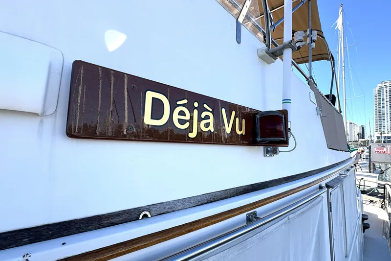 Slide: The Image of 1993 Grand Banks 42 Classic yacht named "Déjà Vu" docked at marina. - 14