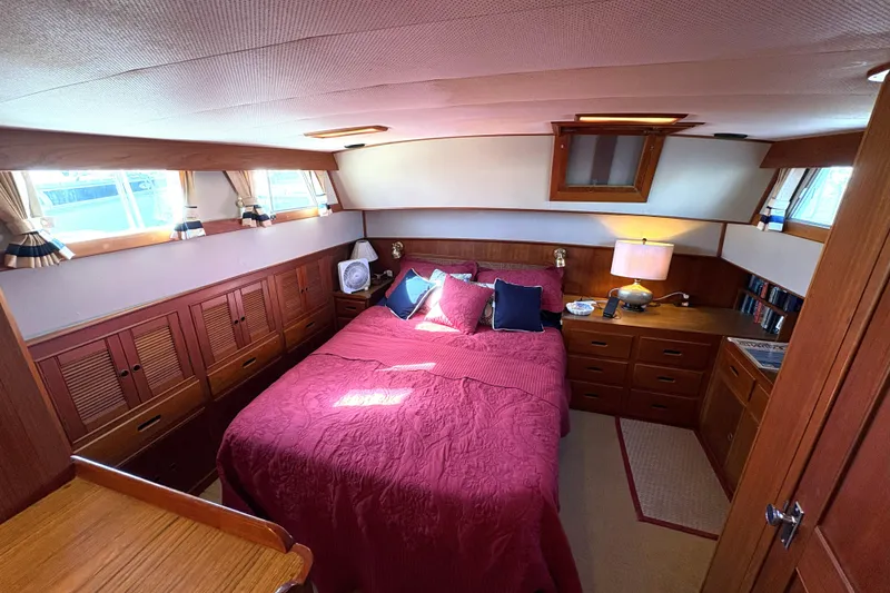 Slide: The Image of Cozy bedroom interior of 1993 Grand Banks 42 Classic yacht with wood furnishings. - 17