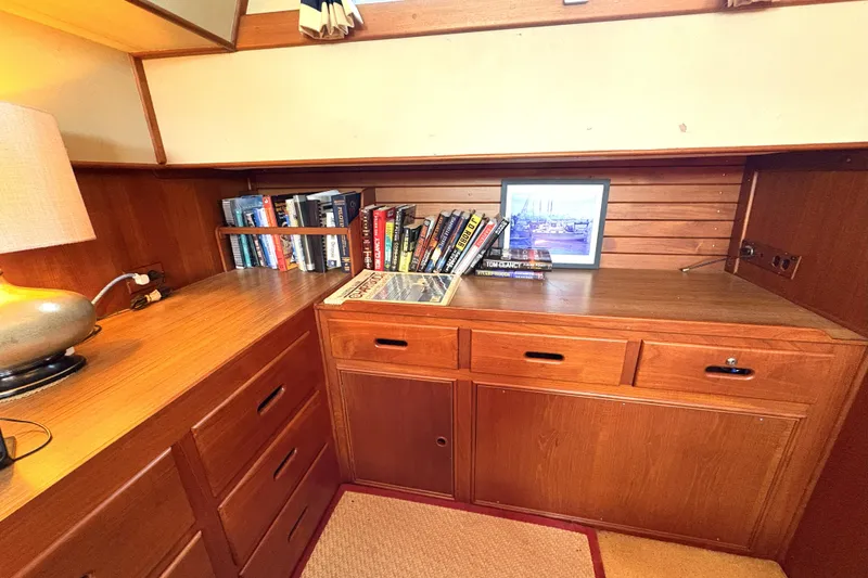Slide: The Image of Cozy wooden interior of 1993 Grand Banks 42 Classic with books and framed photo. - 20
