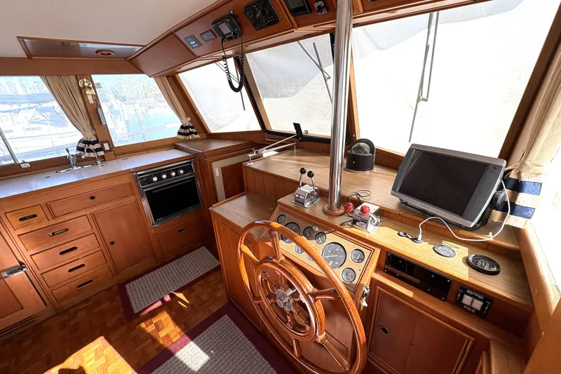 Slide: The Image of Interior of 1993 Grand Banks 42 Classic yacht with wooden helm and navigation equipment. - 21