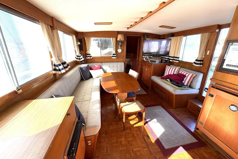 Slide: The Image of Interior of 1993 Grand Banks 42 Classic yacht with cozy seating and wooden decor. - 25